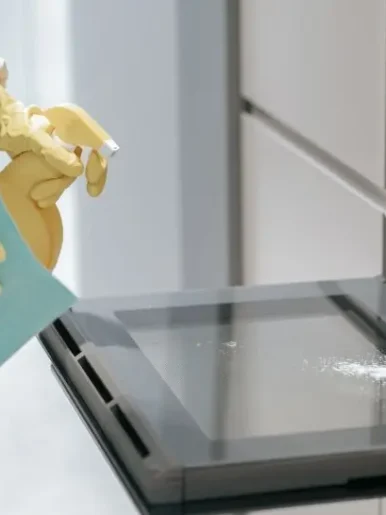 68b84bbab10bebe1a35f91e0_service-person-cleaning-kitchen-appliances